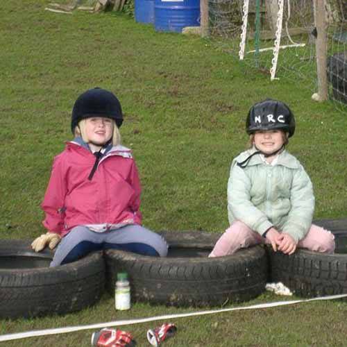 Kids sitting about and laughing at HHF