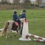 Child walking around on pony