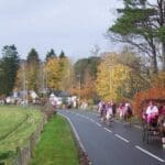 Everyone riding horses through the town for pink day