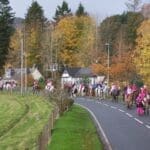 Everyone riding horses through the town for pink day