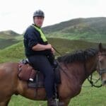 Riding horse through the mountains