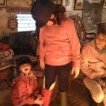 Putting chirstmas boots on before heading out for the day