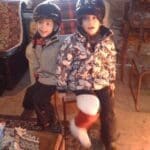 Chidren sitting inside after long day with the horses